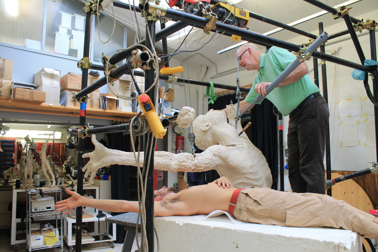 Paddy Campbell working with the wax of “Windand Sea”sculpture at his studio in Via Luna, Florence